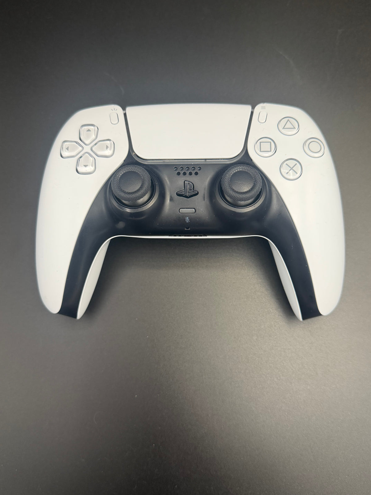 Front view of the exact Glacier White PS5 DualSense controller, unit PS5-WHT-HE-004