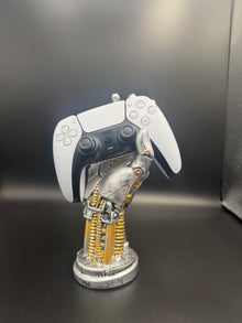 Glacier White PS5 DualSense unit PS5-WHT-HE-003 displayed on a silver robotic hand controller stand