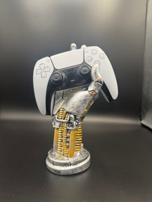 Glacier White PS5 DualSense unit PS5-WHT-HE-004 displayed on a silver robotic hand controller stand