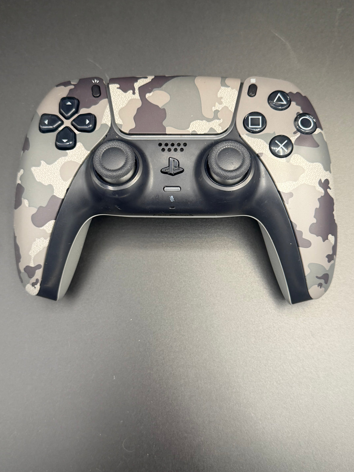 Front view of the exact Gray Camouflage PS5 DualSense controller, unit PS5-CMO-002