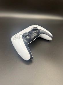 Left-front angled view of Glacier White PS5 DualSense unit PS5-WHT-HE-003 showing the D-pad and left grip