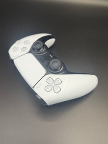 Right-front angled view of Glacier White PS5 DualSense unit PS5-WHT-HE-004 showing the face buttons and right grip