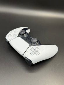 Right-front angled view of Glacier White PS5 DualSense unit PS5-WHT-HE-001 showing the face buttons and right grip