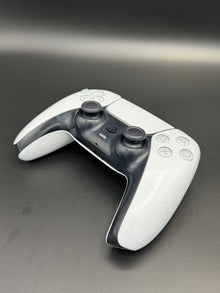 Left-front angled view of Glacier White PS5 DualSense unit PS5-WHT-HE-001 showing the D-pad and left grip